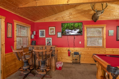 Dry bar, TV, and pool table in the loft space at Alpine Romance, a 2 bedroom cabin rental located in Pigeon Forge
