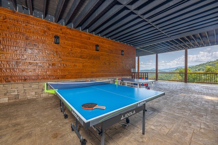 Outdoor ping pong table at Black Bears & Biscuits Lodge, a 6 bedroom cabin rental located in Pigeon Forge
