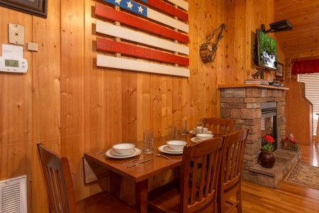 Dining table for four at A Beary Cozy Escape, a 1 bedroom cabin rental located in Pigeon Forge