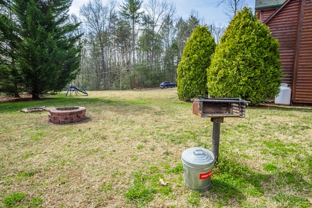 Grill and Firepit at 3 Crazy Cubs, a 5 bedroom cabin rental located in pigeon forge