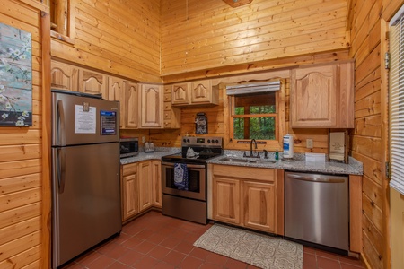 Kitchen with stainless steel appliances at Lazy Mountain Retreat, a 1 bedroom cabin rental located in Gatlinburg