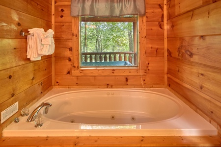 Jacuzzi tub in the bedroom at Love Struck, a 1 bedroom cabin rental located in Pigeon Forge