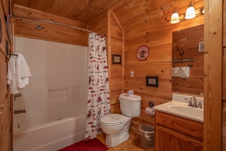 Bathroom with a tub and shower at Logan's Smoky Den, a 2 bedroom cabin rental located in Pigeon Forge