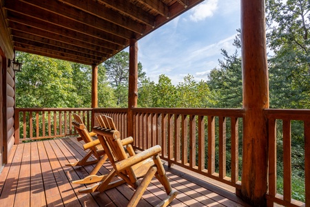 Rocking chairs on deck at The Great Outdoors, a 3 bedroom cabin rental located in Pigeon Forge