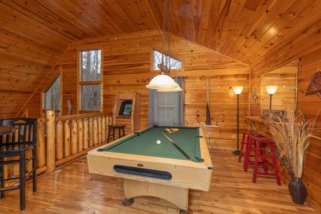 Green felt pool table in the loft space at Whispering Grace, a 2 bedroom cabin rental located in Gatlinburg