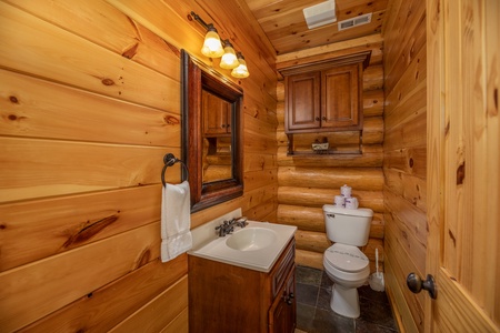 Half bath at God's Country, a 4 bedroom cabin rental located in Pigeon Forge