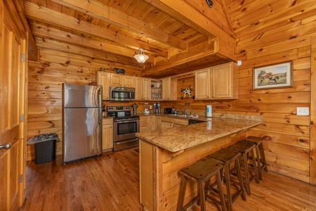 Kitchen with stainless appliances at Family Getaway, a 4 bedroom cabin rental located in Pigeon Forge