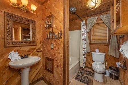 Bathroom with a tub and shower at Bearing Views, a 3 bedroom cabin rental located in Pigeon Forge