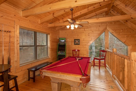 Video game and pool table in the loft at Let the Good Times Roll, a 2 bedroom cabin rental located in Pigeon Forge