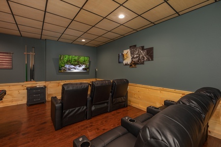 Theater room with large TV at Gar Bear's Hideaway, a 3 bedroom cabin rental located in Pigeon Forge