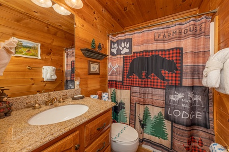 Bathroom with a tub and shower at Hidden Joy, a 1 bedroom cabin rental located in Gatlinburg