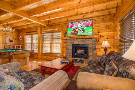 Living Room with Fireplace and Flat Screen at Poolhouse Lodge