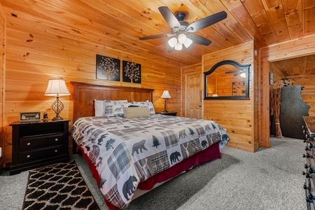 King bed and two night stands in a bedroom at Better View, a 4 bedroom cabin rental located in Pigeon Forge