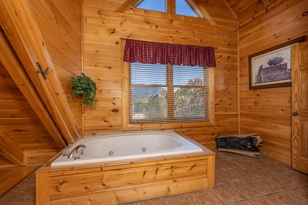 Jacuzzi in a bedroom at Bears Don't Bluff, a 3 bedroom cabin rental located in Pigeon Forge