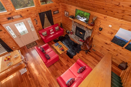 Looking down into the living room from the upper floor at Hibernation Station, a 3-bedroom cabin rental located in Pigeon Forge