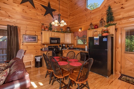 Dining room with seating for six at Bears Eye View, a 2-bedroom cabin rental located in Pigeon Forge