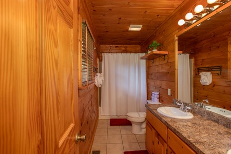 Bathroom at Cabin Fever, a 4-bedroom cabin rental located in Pigeon Forge