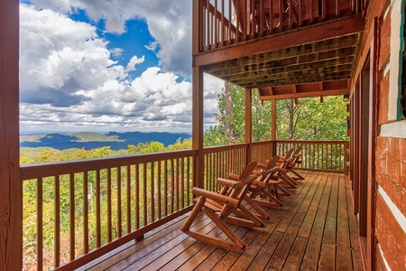 Rocking chairs on the lower deck at Ella-Vation, a 3 bedroom cabin rental located in Gatlinburg