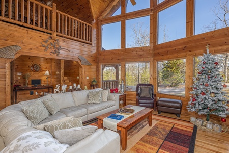 Living room with large sectional sofa at King of the Mountain, a 3 bedroom cabin rental located in Pigeon Forge
