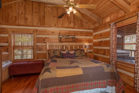 Bedroom with an in room jacuzzi at Blue Mountain Views, a 1 bedroom cabin rental located in Pigeon Forge
