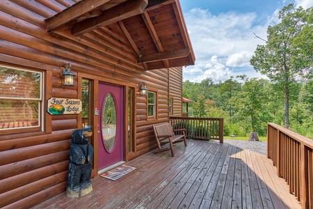 Entry and front porch at Four Seasons Lodge, a 3-bedroom cabin rental located in Pigeon Forge