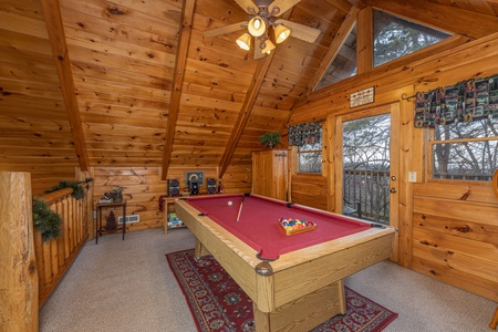 Red felt pool table at A Lover's Secret, a 1 bedroom cabin rental located in Gatlinburg