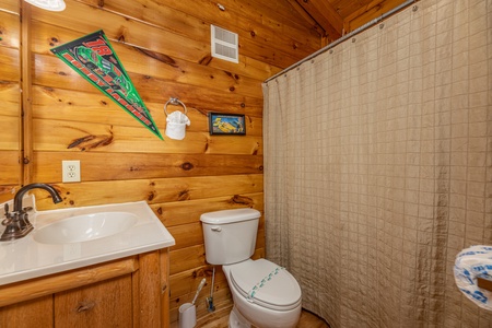 Bathroom with tub and shower at Nascar Nation, a 2 bedroom cabin rental located in Pigeon Forge