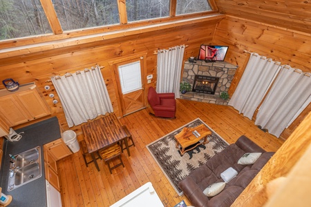 Looking down at the living room at Just You and Me Baby, a 1 bedroom cabin rental located in Gatlinburg