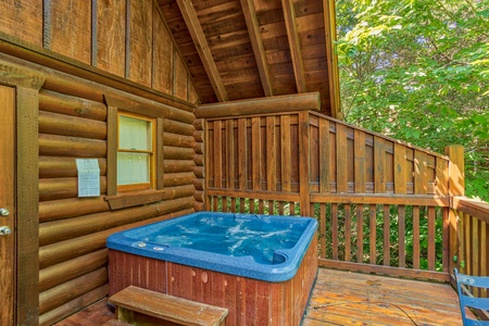 hot tub on the deck with a privacy fence at alpine sunset thrill a 1 bedroom cabin rental located in pigeon forge