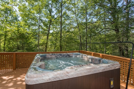 Hot tub on the deck at Forever Country, a 3 bedroom cabin rental located in Pigeon Forge