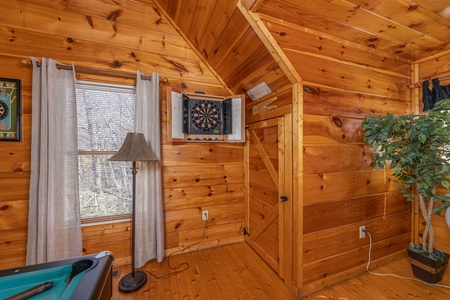 Dart board at Honey Bear Haven, a 1 bedroom cabin rental located in Pigeon Forge