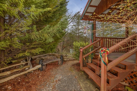 Stairs leading up the deck at Pigeon Forge Pleasures, a 3 bedroom cabin rental located in Pigeon Forge