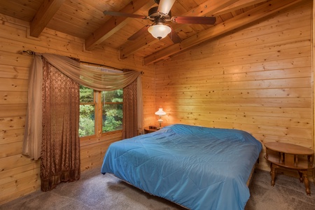 Bedroom with a king bed at Laid Back, a 2 bedroom cabin rental located in Pigeon Forge