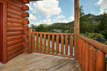 Looking out onto the road from the deck at Kick Back & Relax! A 4 bedroom cabin rental located in Pigeon Forge