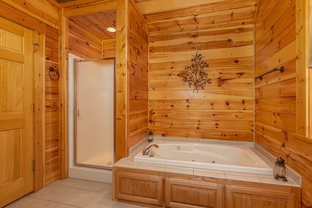 Bathroom with a shower stall and a jacuzzi tub at Sensational Views, a 3 bedroom cabin rental located in Gatlinburg