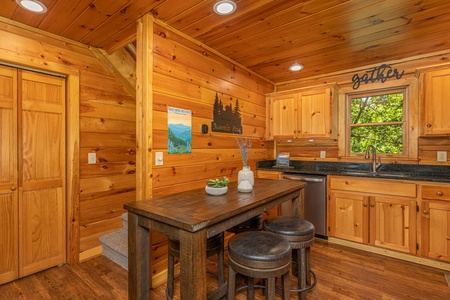 Dining table in the kitchen at Moonlit Pines, a 2 bedroom cabin rental located in Pigeon Forge