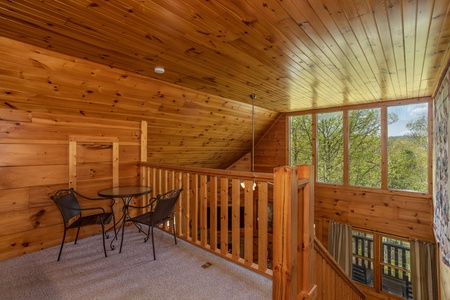 Bistro set in the loft at Hillside Haven, a 1 bedroom cabin rental located in Pigeon Forge