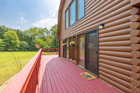 Side and deck view at 1 Crazy Cub, a 4 bedroom cabin rental located in Pigeon Forge