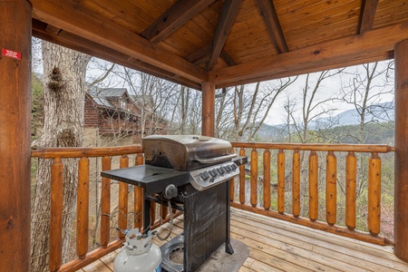 Grill on the deck at Absolutely Wonderful, a 2 bedroom cabin rental located in Pigeon Forge