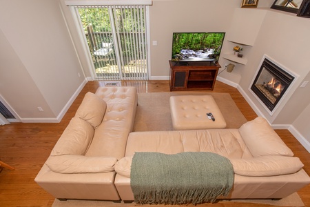 Looking down into the living room from above at Into the Woods, a 3 bedroom cabin rental located in Pigeon Forge