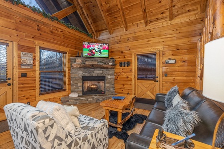 Fireplace and TV in a living room A Bear on the Ridge, a 2 bedroom cabin rental located in Pigeon Forge