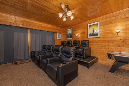 Seating in the theater room at Grizzly's Den, a 5 bedroom cabin rental located in Gatlinburg