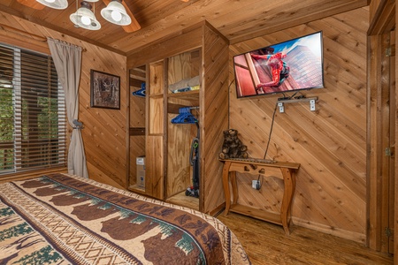 Closet and TV in a bedroom at Bearing Views, a 3 bedroom cabin rental located in Pigeon Forge
