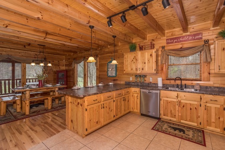 Kitchen with stainless appliances and dining space for six at Mountain View Meadows, a 3 bedroom cabin rental located in Pigeon Forge