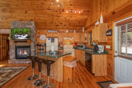 Kitchen and breakfast bar at Hello Dolly, a 1 bedroom cabin rental located in Pigeon Forge