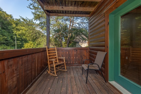 Deck seating at Family Getaway, a 4 bedroom cabin rental located in Pigeon Forge