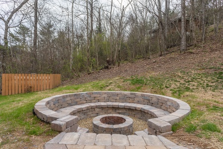 Fire pit built into the hillside at Mountain View Meadows, a 3 bedroom cabin rental located in Pigeon Forge