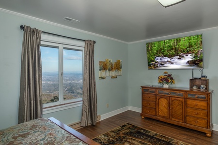 Dresser and TV in a bedroom at Best View Ever! A 5 bedroom cabin rental in Pigeon Forge