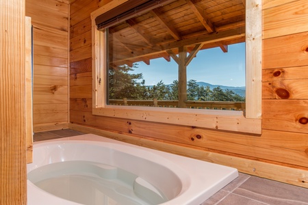 Jacuzzi in a bedroom at Canyon Camp Falls, a 2 bedroom cabin rental located in Pigeon Forge