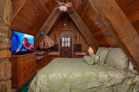 Bed and amenities at Ever After, a 1 bedroom cabin rental located in Gatlinburg